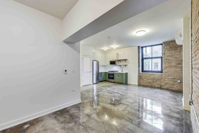 of a modern kitchen integrated into a historic loft space - Chicago west loop apartments