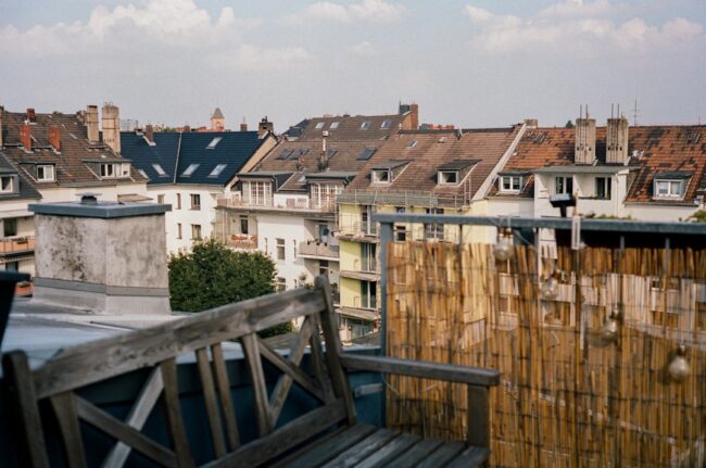 of a rooftop deck on a historic building with city skyline views - Chicago west loop apartments
