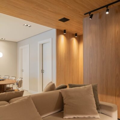 Modern comfortable living room with smart thermostat and subtle lighting - Home Systems
